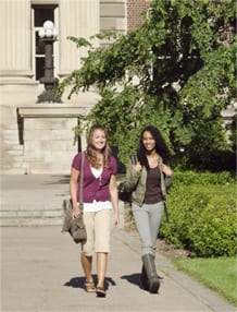 Two female college students walking together